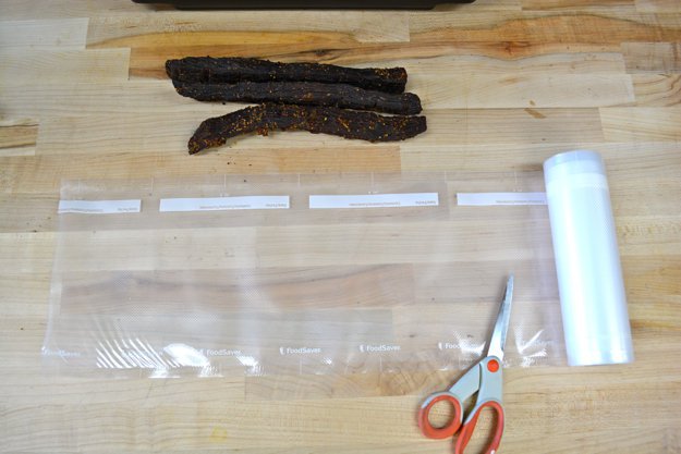 Lay the roll out along side the jerky | Wise Food Storage | Vacuum Sealing Food